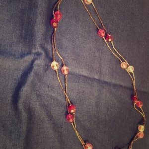 Multiple group of 4 necklaces.